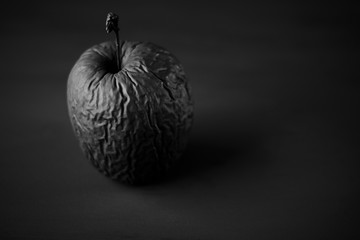 Rotten apple painted black
