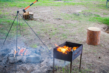 grill flares up for cooking barbecue in nature