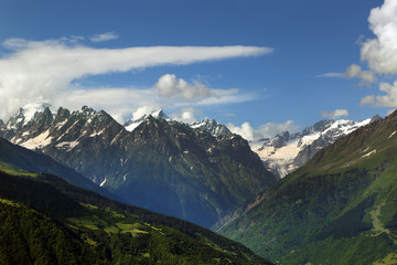 Fototapeta premium View of the snow-capped peaks of the Caucasian mountains in the Upper Svaneti region, Georgia.