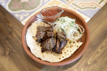 Slices of kebab with onions