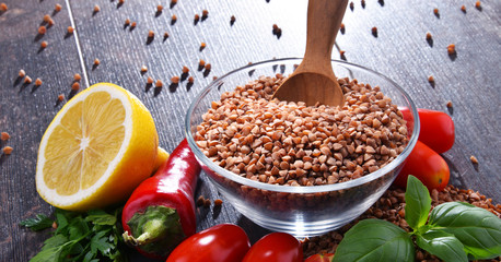 Bowl of buckwheat kasha on wooden table