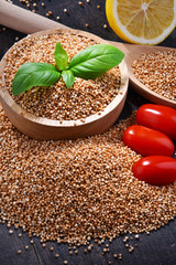 Bowl of amaranth grain on wooden table