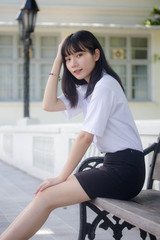 Portrait of thai adult student university uniform beautiful girl relax and smile