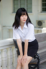 Portrait of thai adult student university uniform beautiful girl relax and smile