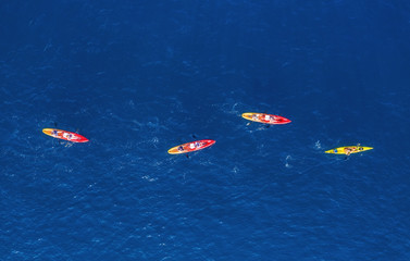 Croatia. Kayks at the sea surface. Aerial view of kyaks on blue Adriatic sea at sunny day....