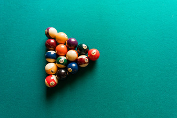 billiard balls on pool table