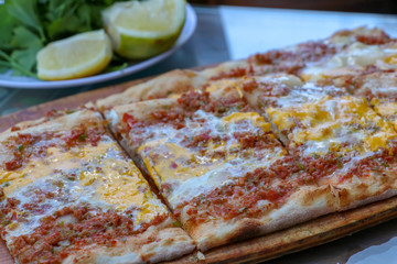 Traditional delicious Turkish foods; meat with eggs pide