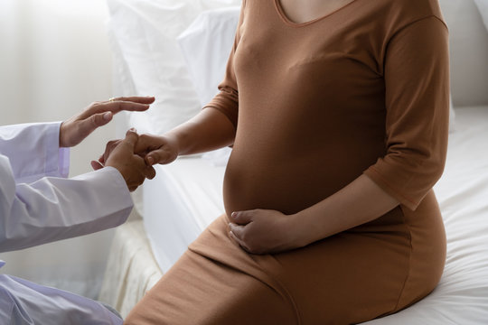 The doctor is encouraging pregnant women.