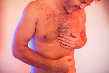 Naklejka premium Man has a heart attack. People, healthcare and medicine concept