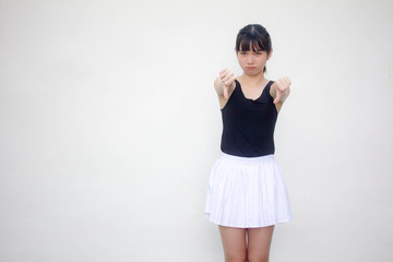 Portrait of thai adult beautiful girl black shirt white skirt do not like
