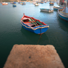 Tilt-shift photography of colurful boat