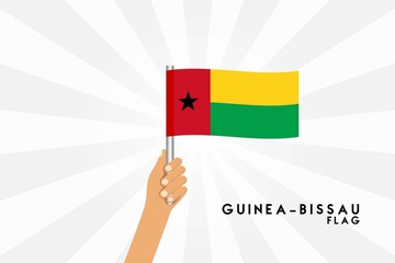 Vector cartoon illustration of human hands hold Guinea Bissau flag. Isolated object on white background.