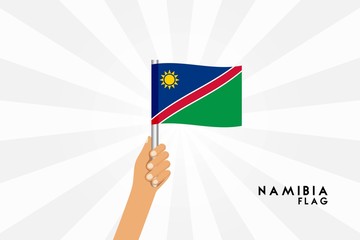 Vector cartoon illustration of human hands hold Namibia flag. Isolated object on white background.