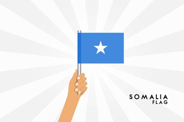 Vector cartoon illustration of human hands hold Somalia flag. Isolated object on white background.