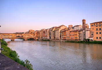 Fototapeta na wymiar A view of the Arno River and the Ponte Vecchio in Florence, Italy.