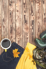 Top view shot of autumn background. Fall woman`s clothes flat lay picture. Woman wardrobe.