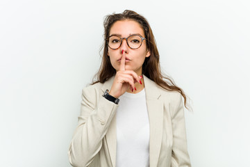 Young european business woman keeping a secret or asking for silence.