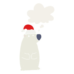 cartoon bear wearing christmas hat and thought bubble in retro style