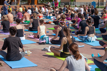 Belgorod , Russia - JUN 15, 2019: A lot of people are engaged in yoga in the park on the International Yoga Day