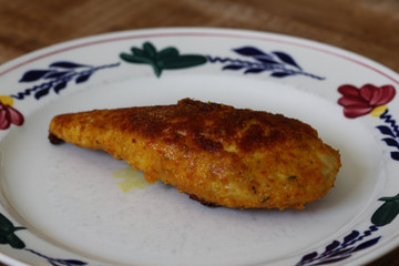 baked cordon bleu or schnitzel cordon bleu on plate