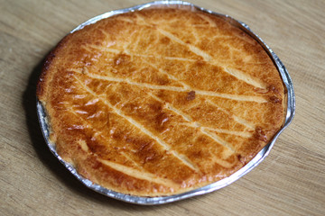 Selfmade Dutch Butter Cake (Boterkoek) cookie, fresh baked from the oven. Displayed on wooden background