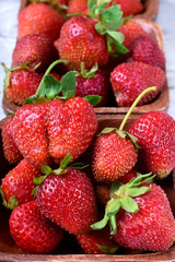 Fresh organic strawberries in little wooden bowls