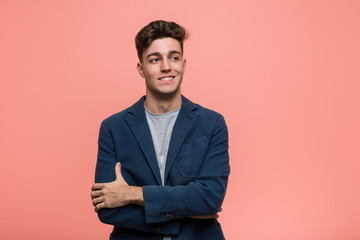 Young business natural man smiling confident with crossed arms.