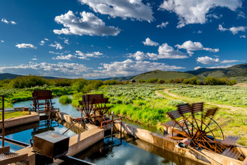 Paddle wheels on an irrigation canal on Idaho farmland