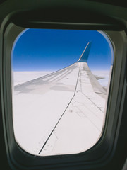 Window View From Passenger Seat On Commercial Airplane