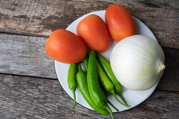 Mexican sauce ingredients. Tomato, serrano pepper and onion