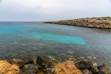 The picturesque blue lagoon on the coast of the calm sea.