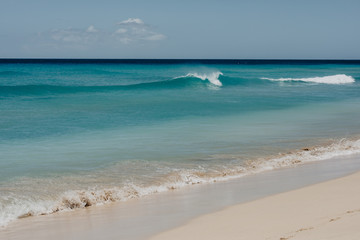 ocean landscape. sand beach and water of blue ocean