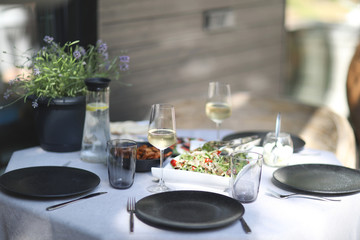 Festive decorated table with snacks and drinks while waiting for guests in the open air