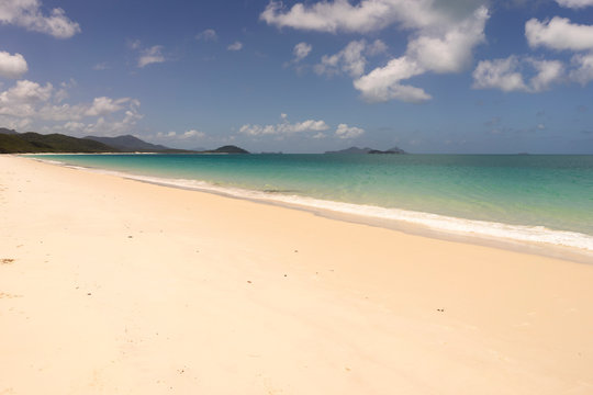 Dreamlike beach with soft sand and Caribbean flair background