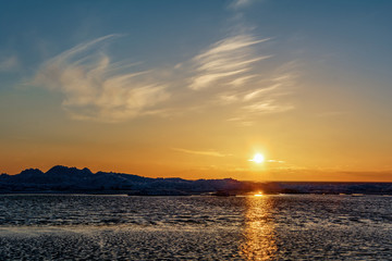 Ice drift at sunset. Pskov region, Russia