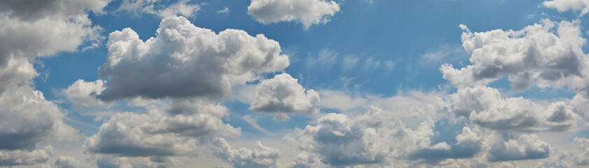 Fototapeta na wymiar Blue sky with white, fluffy clouds