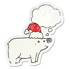cartoon bear wearing christmas hat and thought bubble as a distressed worn sticker