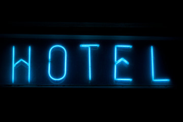 Blue Neon "Hotel" Sign At Night