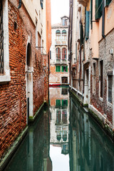 Fototapeta na wymiar Scenic canal with old architecture in Venice, Italy. famous travel destination