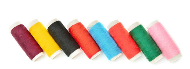 Set of sewing thread isolated on a white background. Wide photo.