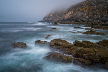 Rocky landscape with fog in the atlantic ocean