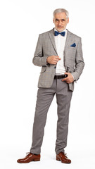 Portrait of smart and handsome intelligent senior man in stylish grey suit isolated on white background