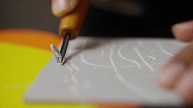 Close Up Of A Linocut Tool Being Used For Lino Printing