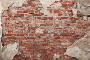 Red brick wall under broken plaster background