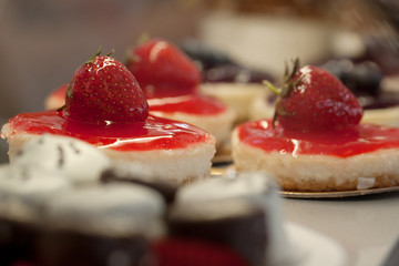 cakes with strawberry in a cafe or in a shop window