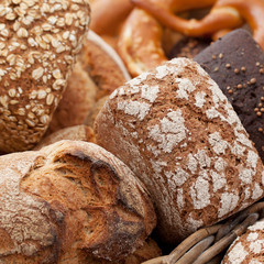 several fresh tasty loaves of white and black bread