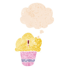 cartoon cupcake with face and thought bubble in retro textured style