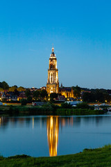 Obraz premium Cuneria church of the city of Rhenen during the evening river Nederrrijn in the provence of Utrecht in the Netherlands