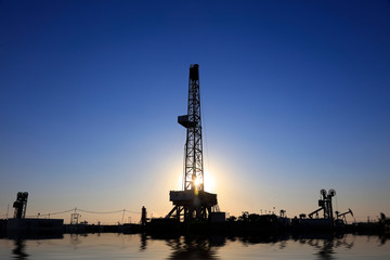 Oil drilling derrick in oilfield