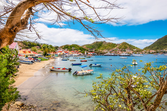 Landscape with small beach and bay with boats. Terre-de-Haut, Les Saintes, Iles des Saintes, Guadeloupe, French Antilles, Caribbean. 